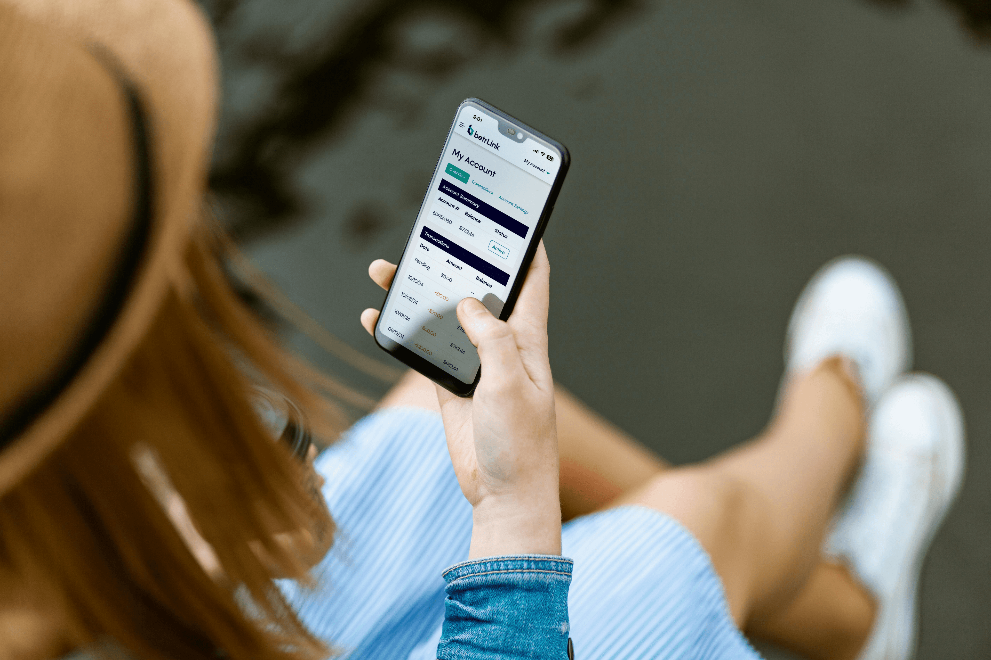 A satisfied customer using the BetrLink portal on their phone.